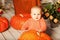 Beautiful woman with a child on the front porch with pumpkins au