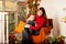 Beautiful woman with a child on the front porch with pumpkins au