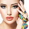 Beautiful woman with creative bright colored make-up.