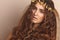 Beautiful Woman. Curly Long Hair. Fashion Model. Healthy Wavy Hairstyle. Accessories. Autumn Wreath, Gold Floral Crown