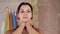 Beautiful woman doing anti-aging exercises. Gymnastics for a face. Facebuilding facial exercises. Face yoga. girl