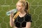 Beautiful woman drinking water from bottle