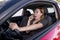 Beautiful woman driving car while texting using mobile phone distracted