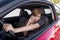 Beautiful woman driving car while texting using mobile phone distracted
