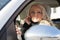 Beautiful woman driving and phoning