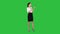 Beautiful woman, dyes her lips lipstick pink, looking in the mirror on a Green Screen, Chroma Key.