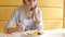 Beautiful woman eating dinner in outdoor restaurant