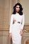 Beautiful woman in elegant dress fashionable autumn Collection of spring long brunette hair makeup tanned slim body figure ac