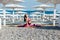 Beautiful woman engaged in fitness yoga gymnastics on the beach by the sea