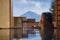 Beautiful woman enjoy onsen mineral hot bath in morning and seeing view of Fuji mountain in japan