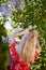 Beautiful Woman Enjoying the Smell of Lilac. Cute Model and Flowers.