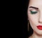 Beautiful woman face on black background. Makeup concept