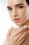 Beautiful Woman With Face Cream. Skin Protection. SkinCare. Spa. A Young Female Holds Moisturizing Cream.