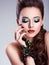 Beautiful woman face with fashion green make-up