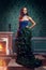 Beautiful woman in fantasy christmas tree dress in rich vintage
