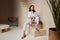 Beautiful woman fashion model brunette hair tanned skin wear white overalls button suit sandals high heels accessory bag clothes