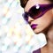 Beautiful woman in fashion violet sunglasses