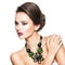 Beautiful woman with fashionable green jewelry