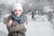 Beautiful woman feeling cold outside in snowy day