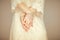 Beautiful woman figure in vintage boho wedding dress showing her hands