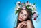 Beautiful woman with flower wreath