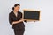 beautiful woman in formal outfit showing the blackboard