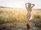 A beautiful woman in golden hay field 3