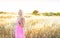 A beautiful woman in golden hay field