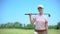Beautiful woman golf player with club smiling on camera, favorite hobby, lessons