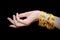 Beautiful woman hand hold gold bracelet jewelry, accessory and f