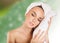 Beautiful woman handle towel in spa salon, after bath