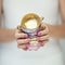 Beautiful woman hands with perfect pink nail polish holding little vintage tea cups