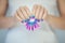Beautiful woman hands with perfect violet pink and turquoise nail polish