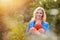 Beautiful woman harvesting pumpkins