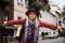 Beautiful woman in hat and dress walking in Istanbul street, Turkey