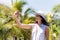 Beautiful Woman In Hat Making Selfie Photo Portrait Over Tropical Forest Landscape Happy Smiling Cute Girl Making Self