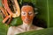 Beautiful woman having fresh papaya facial mask apply. fresh pap