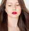 Beautiful woman with healthy gorgeous long hair, natural brunette hairstyle and red lipstick makeup, haircare and beauty