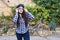 Beautiful woman with helmet put on sunglasses on the background bicycle and street