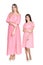 Beautiful woman and her daughter in pink dresses