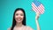 Beautiful woman holding American speech bubble, foreign language courses, travel