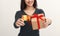 Beautiful woman holding credit card and gift box