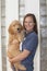 Beautiful Woman Holding Goldendoodle Puppy