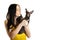Beautiful woman holding little toy terrier dog