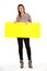 Beautiful woman holding a yellow, blank paper