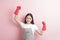 Beautiful woman housekeeper portrait on pink background