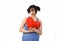 Beautiful woman hurt and suffering for lost love holding red heart shape pillow