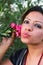 Beautiful woman kiss flowers