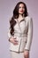 Beautiful woman lady spring autumn collection glamor model business office fashion clothes wear casual style beige color suit