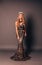 Beautiful woman with long blond hair in luxurious evening dress
